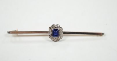 An early 20th century 15ct and plat, sapphire and diamond oval cluster set bar brooch, 64mm, gross