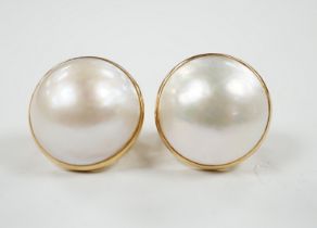 A modern pair of 750 yellow metal and mabe pearl set earrings, diameter 18mm, gross weight 11.9