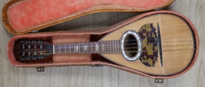 A cased Italian mandolin, labelled Domenico Maratea, and Fratelli Vinaccia, Naples, bowl backed
