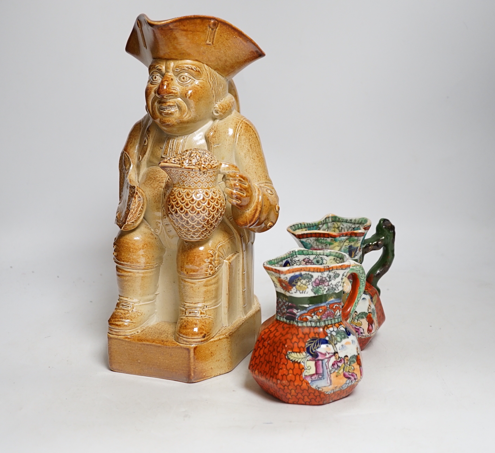 Sundry ceramics including pair of Masons Ironstone jugs, two Toby jugs and faience glazed armorial