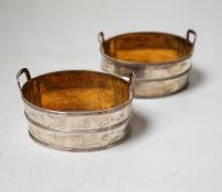 A pair of George III silver salts, modelled and oval two handled tubs, by John Emes, with reeded