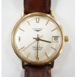 A gentleman's 9ct gold Longines Flagship automatic wrist watch, with baton numerals and date