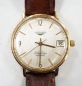 A gentleman's 9ct gold Longines Flagship automatic wrist watch, with baton numerals and date