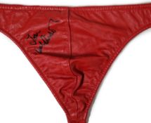 A red leather thong, as worn by Tom Wilkinson in the film The Full Monty and signed by him, together
