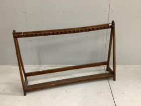 A 19th century beech gun rack, width 127cm, height 81cm