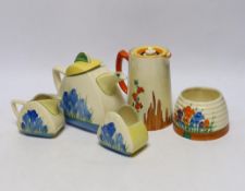 A Clarice Cliff Blue crocus three piece teaset, and two other pieces
