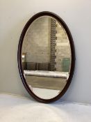 A large bespoke oval brass mounted mahogany mirror by Archer and Smith, width 118cm, height 179cm