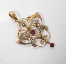 An Edwardian 9ct, garnet and seed pearl cluster set drop pendant, overall 47mm, gross weight 2.8