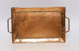 A John Pearson Arts & Crafts planished copper tray, 34cm wide