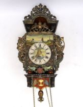 A vintage Dutch clock, hand painted with a landscape and flowers, with pendulum and weights, 53cm