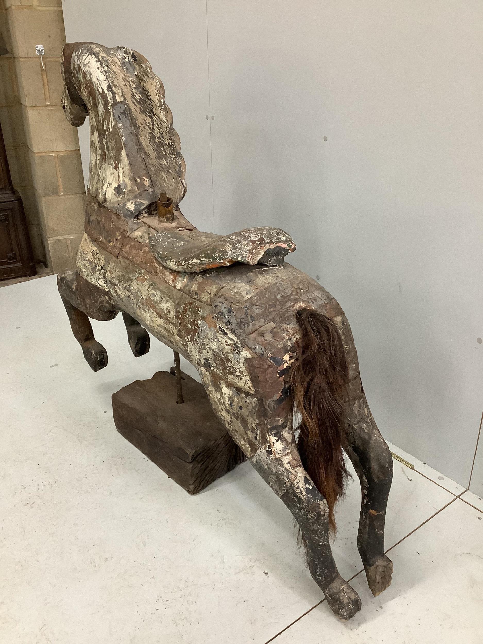 A vintage metal bound carved wood carousel fairground horse with traces of original paint, length - Image 3 of 3