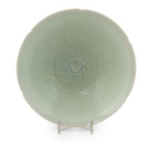 A Chinese Qingbai style pale celadon glazed bowl, of broad conical form with petalled rim and