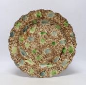 A mid 18th century Whieldon ‘’tortoiseshell’’ creamware dish, 36cm in diameter