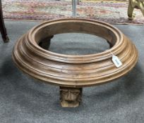 An Indonesian hardwood stand, lion head supports, diameter 67cm