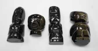 Three 20th century Aztec Mayan style carved obsidian stylised figures and a similar mask (4) tallest