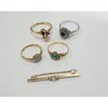 Three assorted 18ct and gem set rings, including 1920's diamond cluster, size K/L, one other early