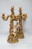 A pair of Sitzendorf / Plaue figural and floral encrusted candelabra, 47cm high