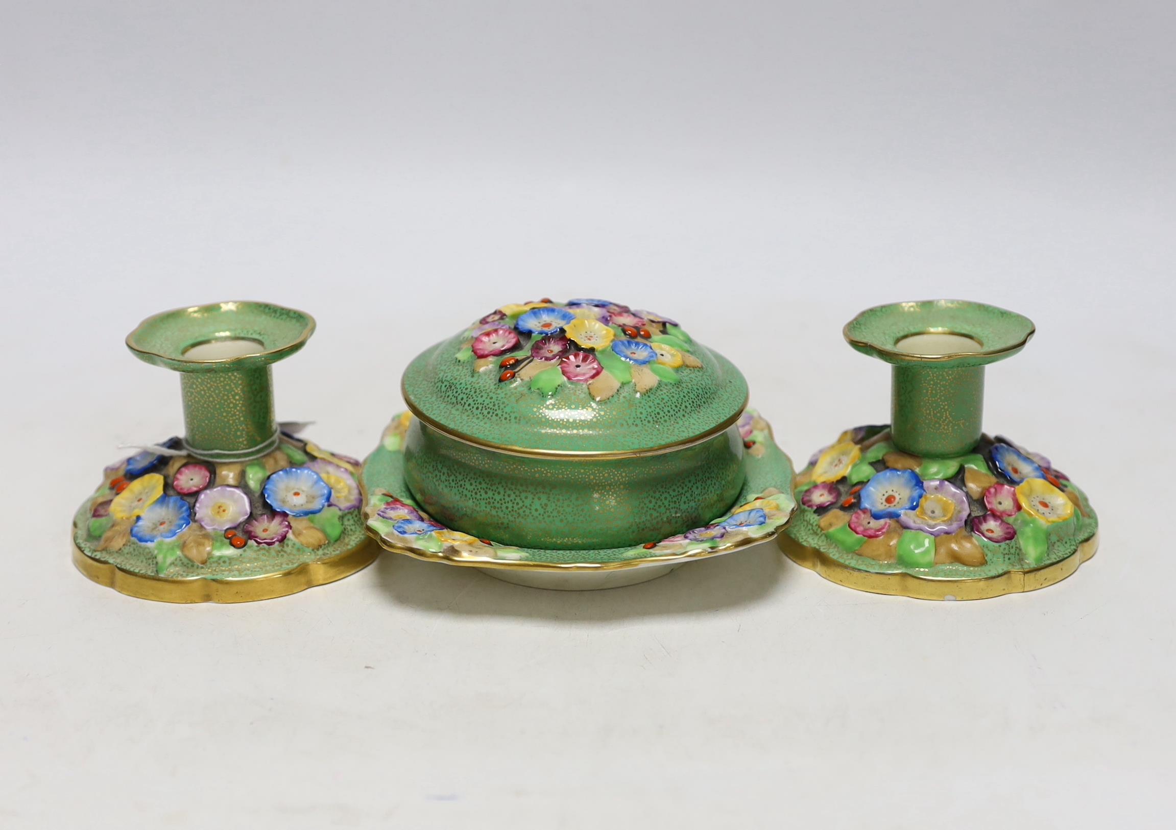 A pair of Tuscan china "Plant" pattern floral encrusted dwarf candlesticks, a circular lidded box