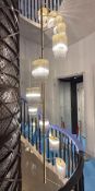 A contemporary stairwell chandelier by Baroncelli