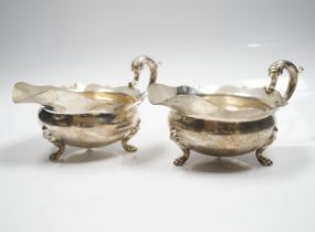 A pair of George V silver sauce boats, by Goldsmiths & Silversmiths Co Ltd, London, 1927 and 1932,