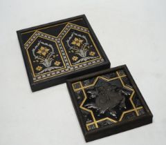 Two Minton tiles comprising one decorated in relief with a Hippocampus and one with geometric floral