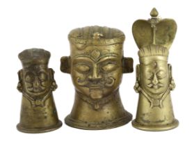 A group of three brass alloy Shiva Mukhalingam, Southern India, 16th-18th century, each depicting