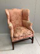 A 19th century upholstered wing armchair, width 82cm, depth 72cm, height 112cm