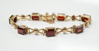A 1960's 9ct gold and seven stone garnet set bracelet, by Cropp & Farr, 18cm, gross weight 17.9