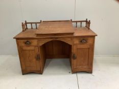 A late Victorian pitch pine kneehole desk, width 137cm, depth 67cm, height 93cm