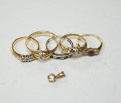 Four assorted early 20th century and later 18ct and gem set rings, including solitaire diamond and