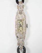 A lady's white metal (engraved platinum) and diamond cluster set manual wind cocktail watch, on a