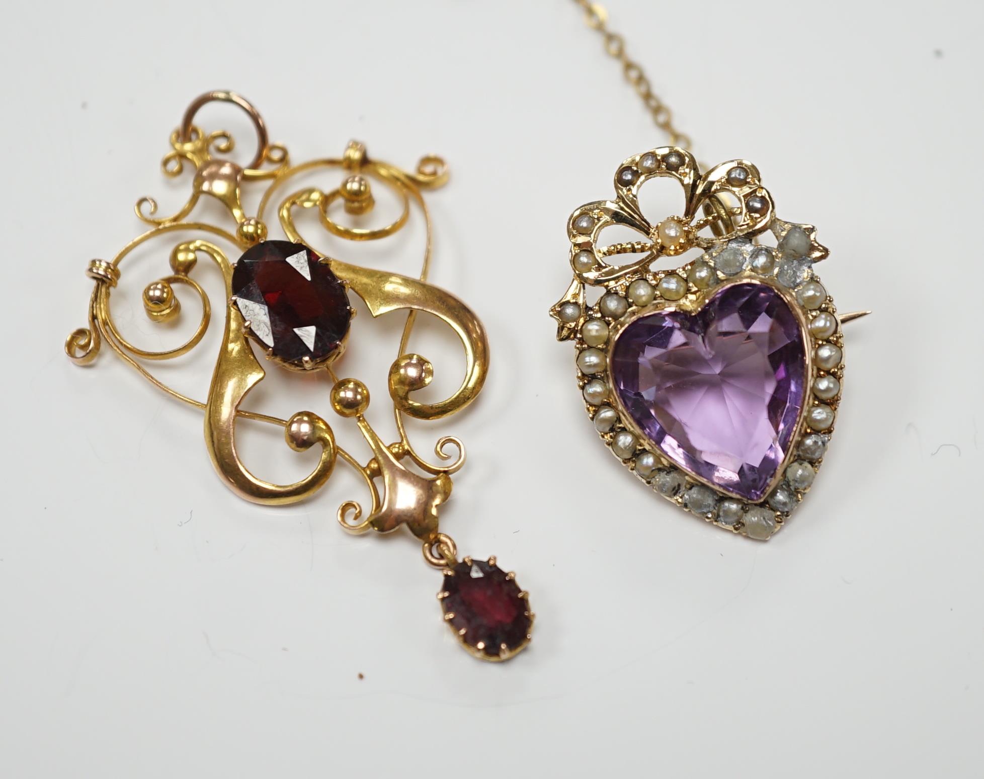 An early 20th century yellow metal, amethyst and seed pearl cluster set heart shaped brooch, 27mm,