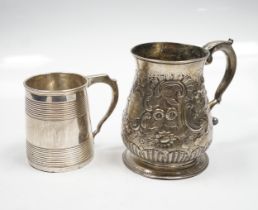 A late George II silver baluster mug, with later embossed decoration, William Shaw II?, London,