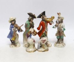 A 19th century four piece Meissen monkey band and a pair of Sampson pheasants