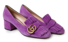 A pair of Gucci pink GG Marmont suede pumps detailed with fringe and topped with Gucci's signature
