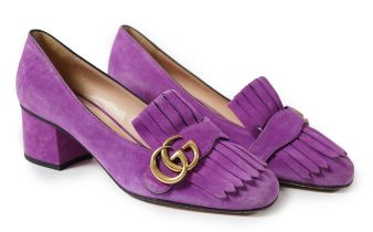 A pair of Gucci pink GG Marmont suede pumps detailed with fringe and topped with Gucci's signature