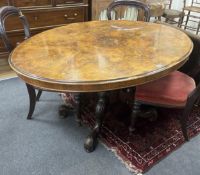 A Victorian inlaid burr walnut oval tilt top loo table, width 134cm, depth 102cm, height 71cm