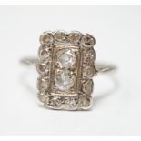 An early 20th century white metal and diamond cluster set tablet ring, size P/Q, gross weight 2.2