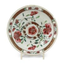 A Chinese famille rose reticulated saucer dish, Qianlong, decorated with flowers, the sides with