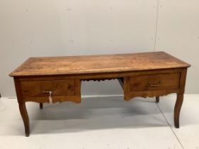 A late 18th century French Provincial fruitwood kneehole table, width 178cm, depth 70cm, height