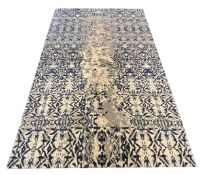 An Elizabeth Ashard 'Moghul', a silk and wool blue tones pattern carpet, 665 x 440cm