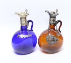 Two Victorian electroplate mounted glass spirit flasks, a silver whisky label and two plated