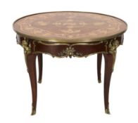 A Louis XVI style ormolu mounted marquetry centre table, decorated with musical, agricultural and