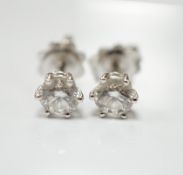 A pair of 18ct white gold and solitaire diamond set ear studs, total diamond weight approximately