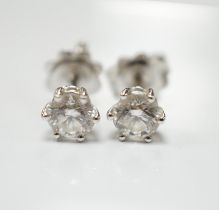 A pair of 18ct white gold and solitaire diamond set ear studs, total diamond weight approximately