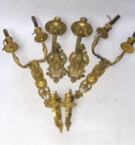 A pair of ormolu two branch wall lights, a pair of single branch mask wall lights and a small pair