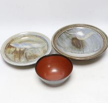 A bowl by Suleyman Saba, Australia and two shallow pottery bowls, largest diameter 28cm