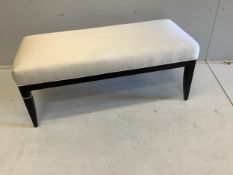 A rectangular cushion topped stool, width 106cm, depth 46cm, height 44cm