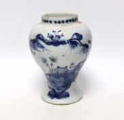 An 18th century Delft blue and white baluster vase, 17cm