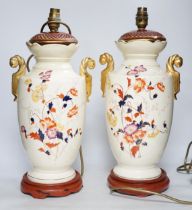 A pair of early 20th century vases mounted as table lamps, hand painted with flowers, 45cm high